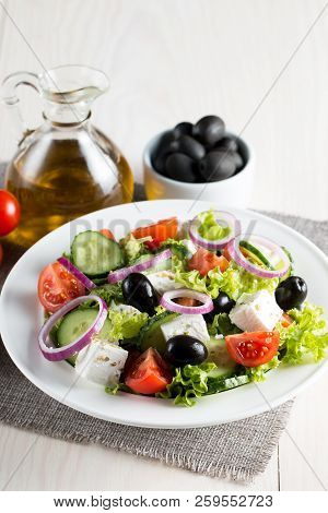 Fresh Greek Salad Made Of Cherry Tomato, Ruccola, Arugula, Feta, Olives, Cucumbers, Onion And Spices