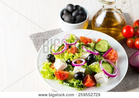 Fresh Greek Salad Made Of Cherry Tomato, Ruccola, Arugula, Feta, Olives, Cucumbers, Onion And Spices