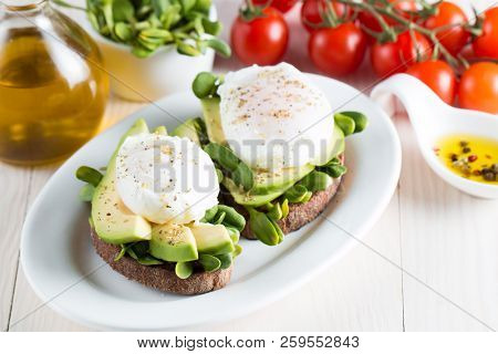 Avocado Toast, Cherry Tomato On Wooden Background. Breakfast With Toast Avocado, Vegetarian Food, He
