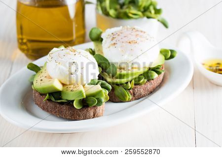 Avocado Toast, Cherry Tomato On Wooden Background. Breakfast With Toast Avocado, Vegetarian Food, He