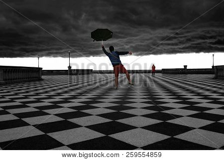 A Man Holding Tight On His Flying Broken Umbrella In Terrazza Mascagni With A Cloudy Sky And Storm B