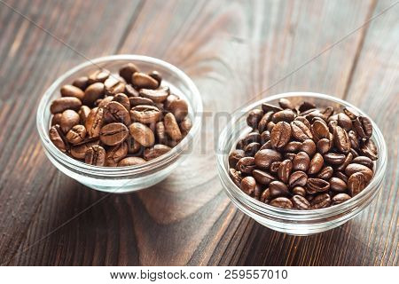 Bowls Of Arabica And Robusta Coffee Beans