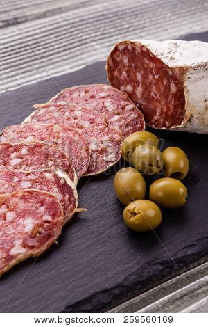 Saucisson Sec Delicious French Salami On A Wooden Background