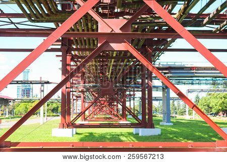 Red Metal Structures, Wheel Supports For Pipes, Pipeline Trestle From Large Beams, Piles And Stiffen