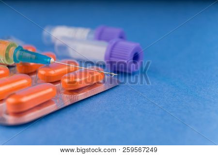Tablets In A Blister, A Syringe With The Typed Medical Preparation And Test Tubes For Analyses.. Dop