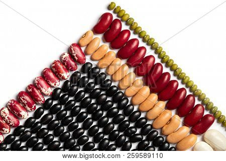 Pyramid of beans. Multicolored Legumes Textures: red beans, kidney beans, black eye, pinto, lentil on white background. 