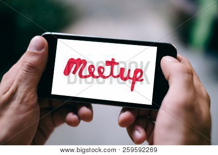 Berlin, Germany - August 26, 2018: Closeup Of Smartphone Screen With Meetup Logo And Icon