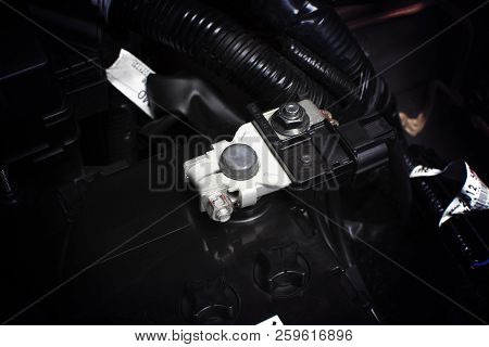 Battery Cathode Terminal And Wire Installed On A Black Battery In A Electric System Of Eco Car Engin