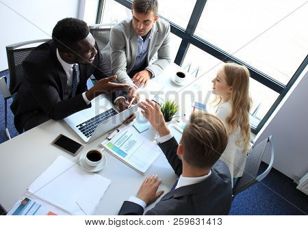 Top View Of Business People Working Together While Spending Time In The Office.