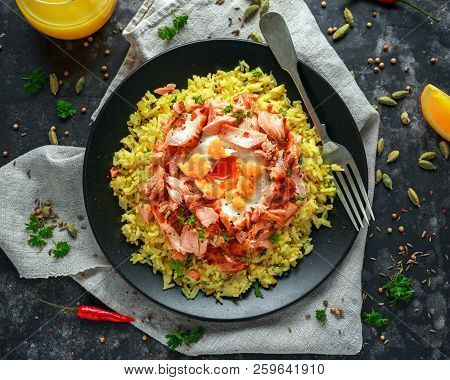 Traditional Indian-english Kedgeree Breakfast: Basmati Rice With Egg Benedict And Hot Smoked Sweet C