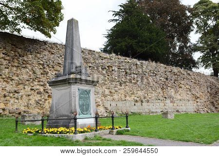 Tonbridge, England - September 8, 2018: Boer War Memorial Surrounded By Flowers, Outside The Norman 
