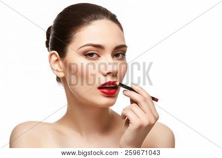 Girl Applying Red Lipstick Isolated On White
