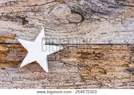 Christmas Star Decoration On Old Wooden Background With Copy Space