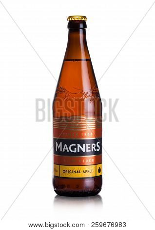 London, Uk - September 13, 2018: Bottle Of Magners Original Cider On White Background With Reflectio