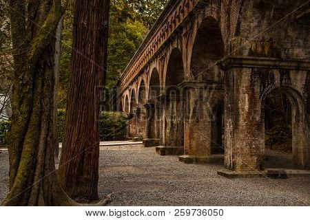 Kyoto, Japan - 08 Feb 2018: Closed Up Of A Red Brick Bridge In Nanzen-ji Temple Surrounded By Trees