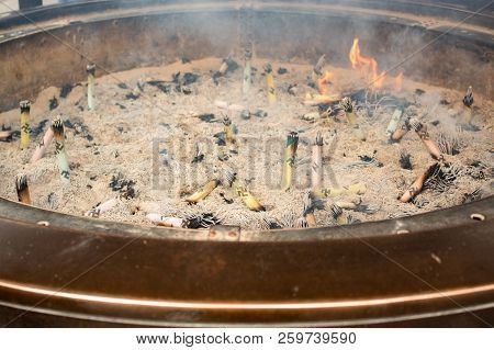 Tokyo, Japan - 13 Feb 2018: Tight Shot Of Religious Burning Incense And Ashes In Senso-ji Shrine Tem