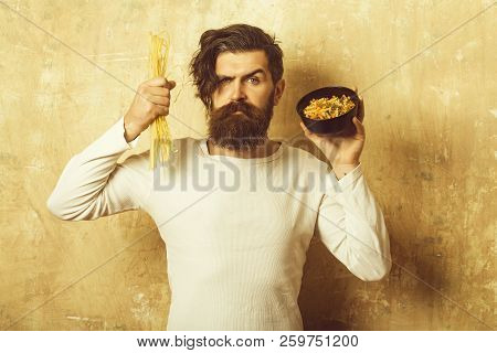 Hipster Hold Italian Macaroni. Man With Pasta In Hand. Cook Or Chef Bearded Man With Bowl. Healthy F