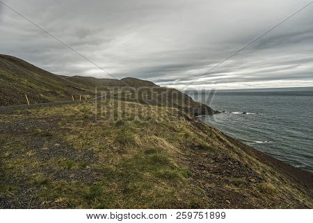 Coastline Of The Northern Tip Of Trollaskagi Peninsula, Iceland With The Road Winding Through