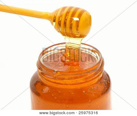 honey dripper and jar isolated on white background