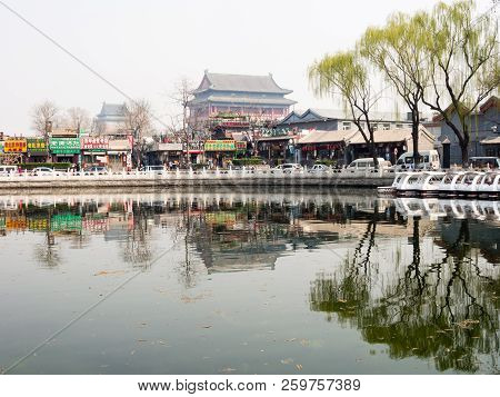 Beijing, China - March 26, 2015: Morning Mist Over Houhai Lake With Drum Tower And Bell Tower At The