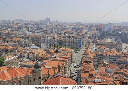 Scenic View Of Porto, Portugal From The Window Of The Tower. Orange Roofs Of The Houses. Popular Tou