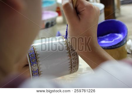 Artist Painting Benjarong Ceramic Ware