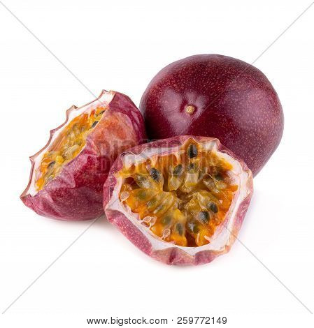 Whole And Cut Passion Fruits Isolated On White Background With Clipping Path