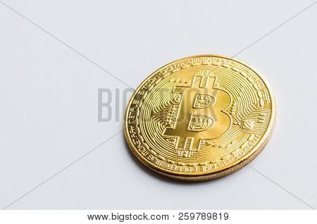 Golden Bitcoin On White Background. Concept Mining. Copyspace