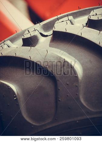 Agriculture Equipment Concept. Detailed Closeup Agricultural Machinery, Big Wheels With Tires. Outdo