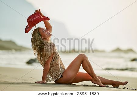 young woman relaxing on the beach in summer day