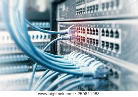 Network cables in switch and firewall in cloud computing data center server rack