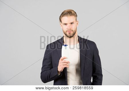 Dandruff Common Male Problem. Remedies Get Rid Of Dandruff. Man Formal Suit Hold Bottle Shampoo Grey