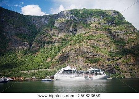 Aurlandsfjord, Flam, Norway - 27 July, 2018: Cruise Liner And Boats Near Majestic Mountains At Aurla