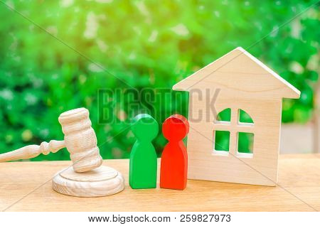 House, Hammer Of The Judge With Wooden Figures Of People. Clarification Of Ownership Of Property. Co