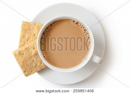 A Cup Of Tea With Milk And Two Square Shortbread Biscuits Isolated On White From Above. White Cerami
