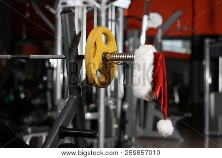 Santa Claus Hat On Barbell In Gym
