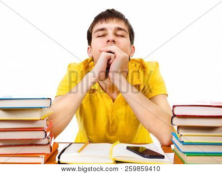 Sleepy Student On The School Desk Isolated On The White Background