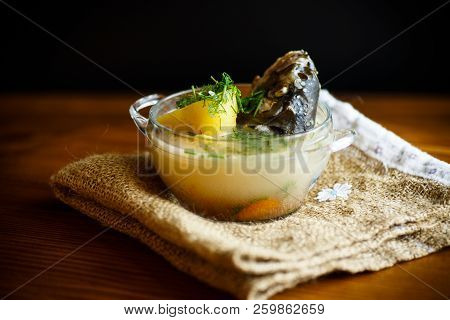 Vegetable Soup With Fish In A Glass Bowl
