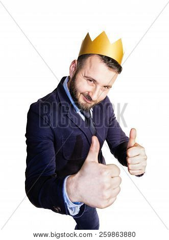 The Concept Of Leadership, Excellence. Portrait Of A Smiling Man With A Golden Crown On His Head. Is
