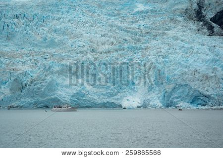 An Unidentified Boat Cruise Shows The Scale Of The Large Holgate Glacier, A Tidewater Glacier In Ken