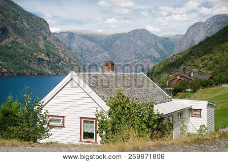 Beautiful Wooden Houses In Flam Village At Majestic Aurlandsfjord Aurlandsfjorden , Norway