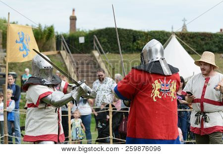 Sword Fight Between Two Combat Fighters Dressed In Medieval Armour