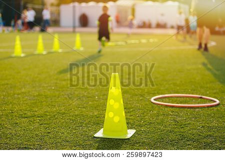 Football Soccer Training Equpment On Practice Session. Soccer Equipment On Soccer Pitch. Coach And Y