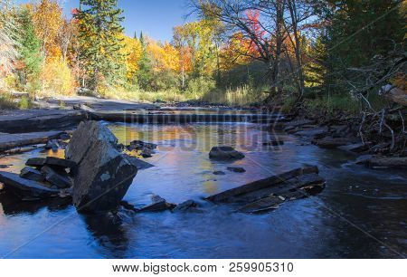 Autumn Forest River Landscape, Vibrant All Foliage Reflected In Wilderness River At The Canyon Falls