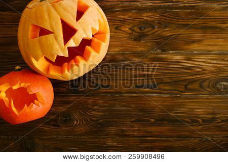 Halloween Themed Image With Carved Pumpkins In House Party Environment.