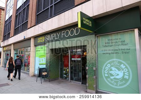 London, Uk - July 7, 2016: People Walk By Marks & Spencer Simply Food Grocery Store In London. Simpl