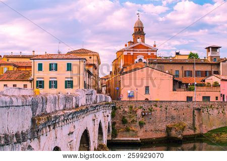 The Bridge Of Tiberius In Rimini. Historic Centre Of Rimini. Rimini Cityscape In The Evening. Sights