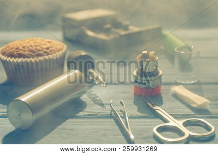 Still Life With E-ciggarete And Coffe On The Wooden Background