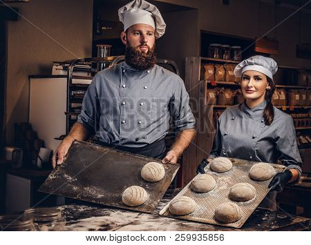 Cooking Master Class In Bakery. Chef With His Assistant Showing Ready Samples Of Baking Test In Kitc