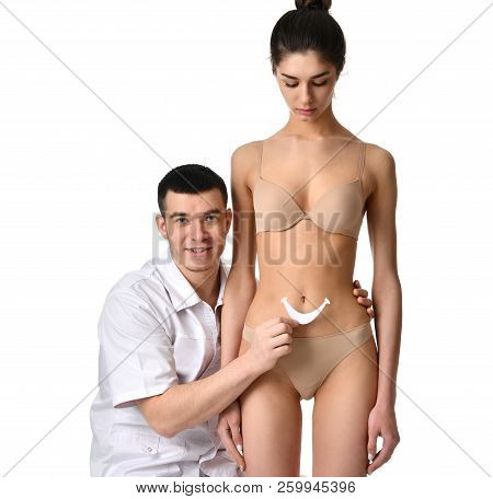 Doctor And Patient Stomach Or Making Abdomen Massage Concept With Smole Isolated On White Background
